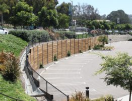 We completed this beautiful permanent curved soldier pile and lagging wall next to a parking lot.