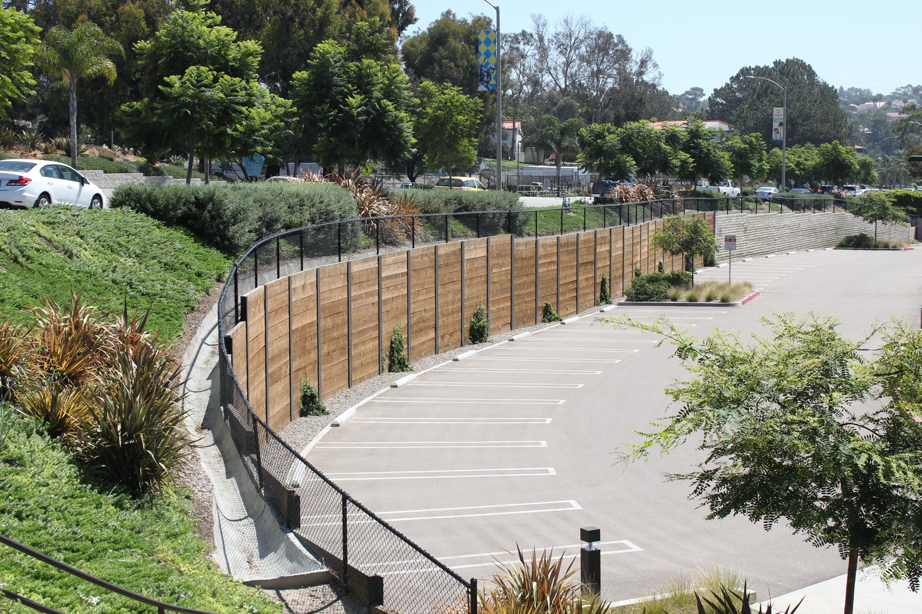 We completed this beautiful permanent curved soldier pile and lagging wall next to a parking lot.